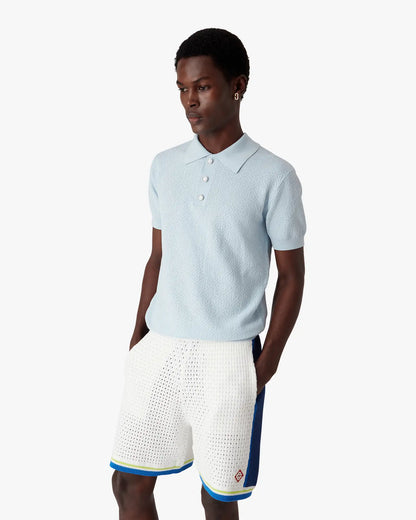 Polo à manches courtes monogramme ajouré bleu