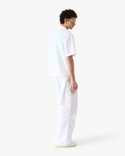 Chemise brodée à manches courtes avec collage d'icônes graphiques
