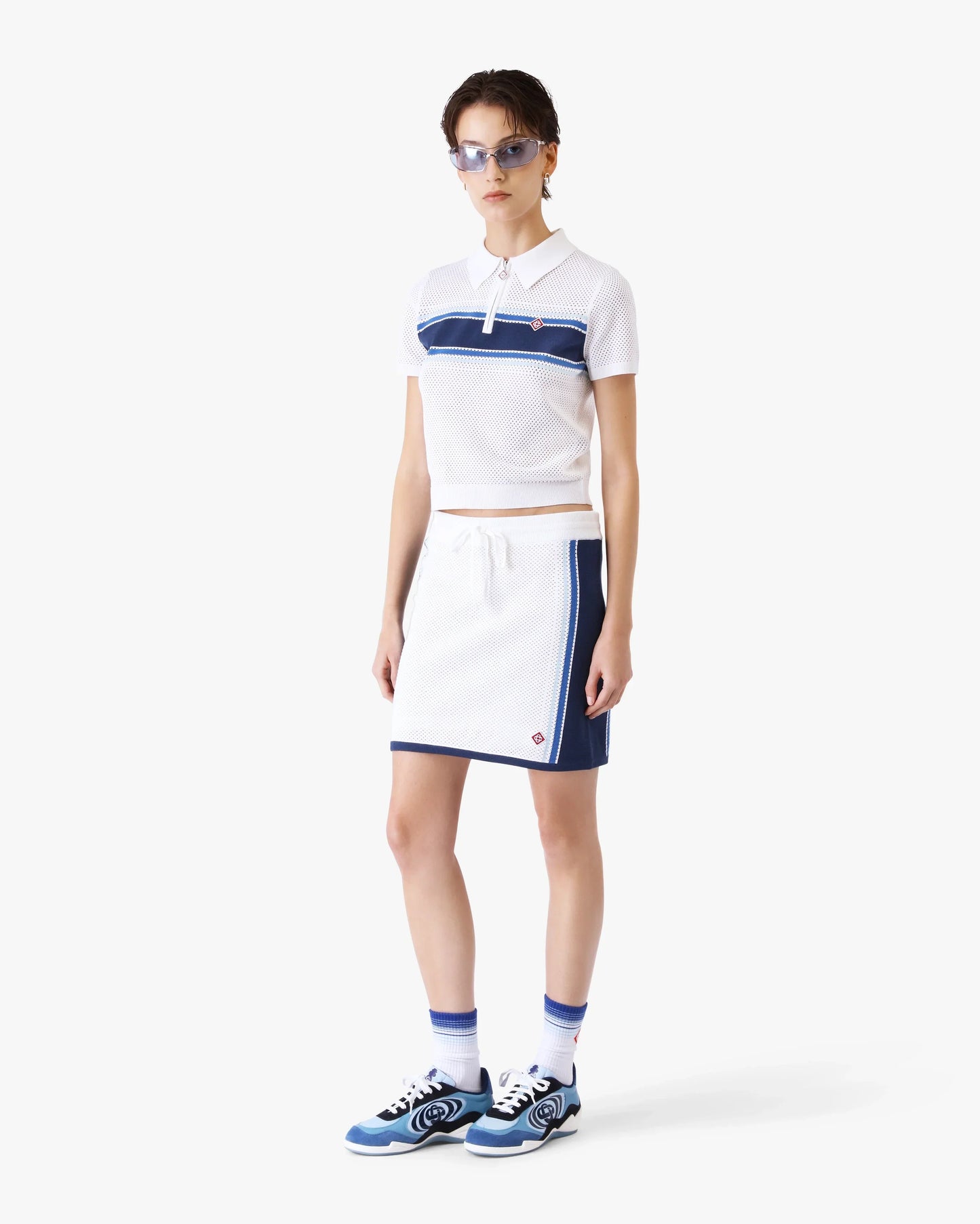 Polo en maille rayée blanc et bleu